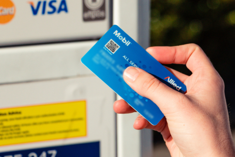 Image of someone using an Allied Mobilcard at a fuel station pump